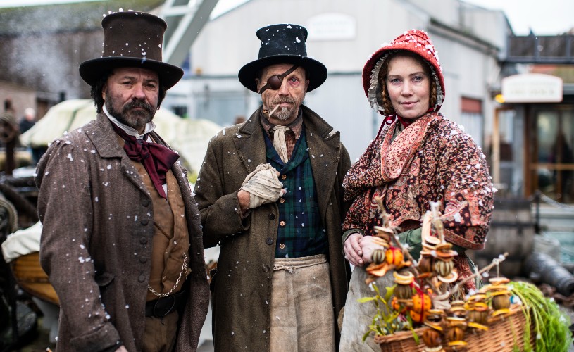 Three people in Victorian costume at SS Great Britain